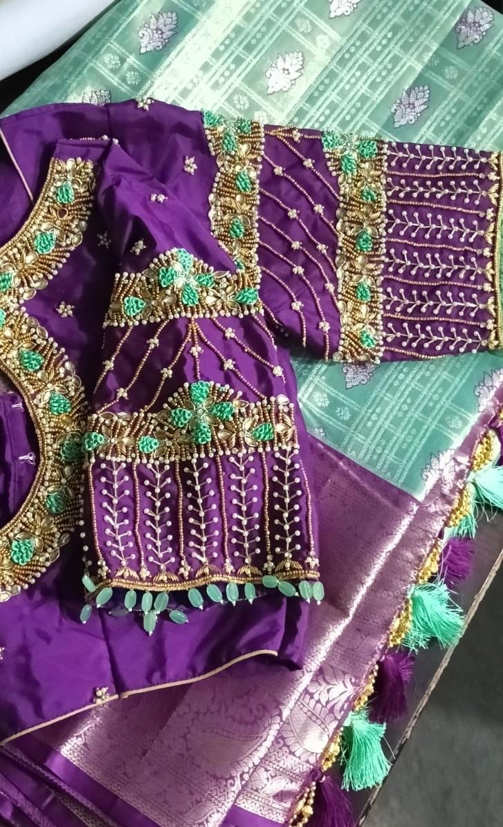 Purple bridal blouse with gold zari and green maggam work embroidery