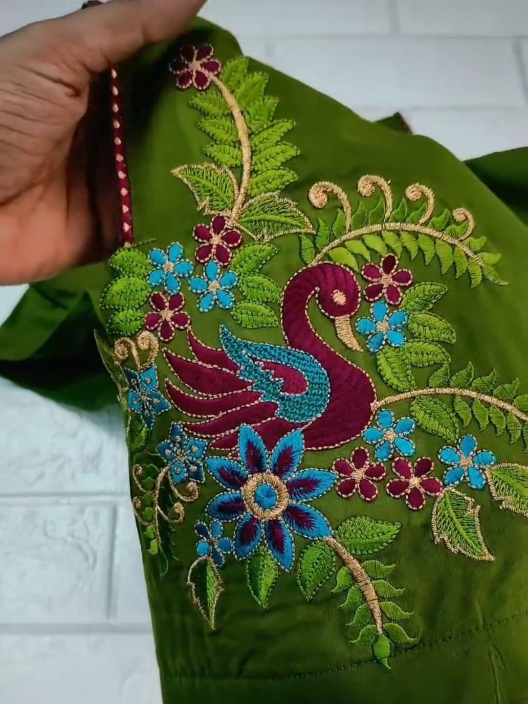 Green maggam work blouse with peacock, flowers and beaded embroidery