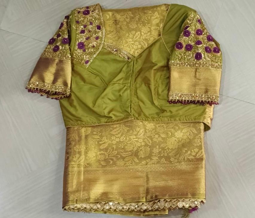 Green and gold silk blouse with purple floral maggam work and zari embroidery