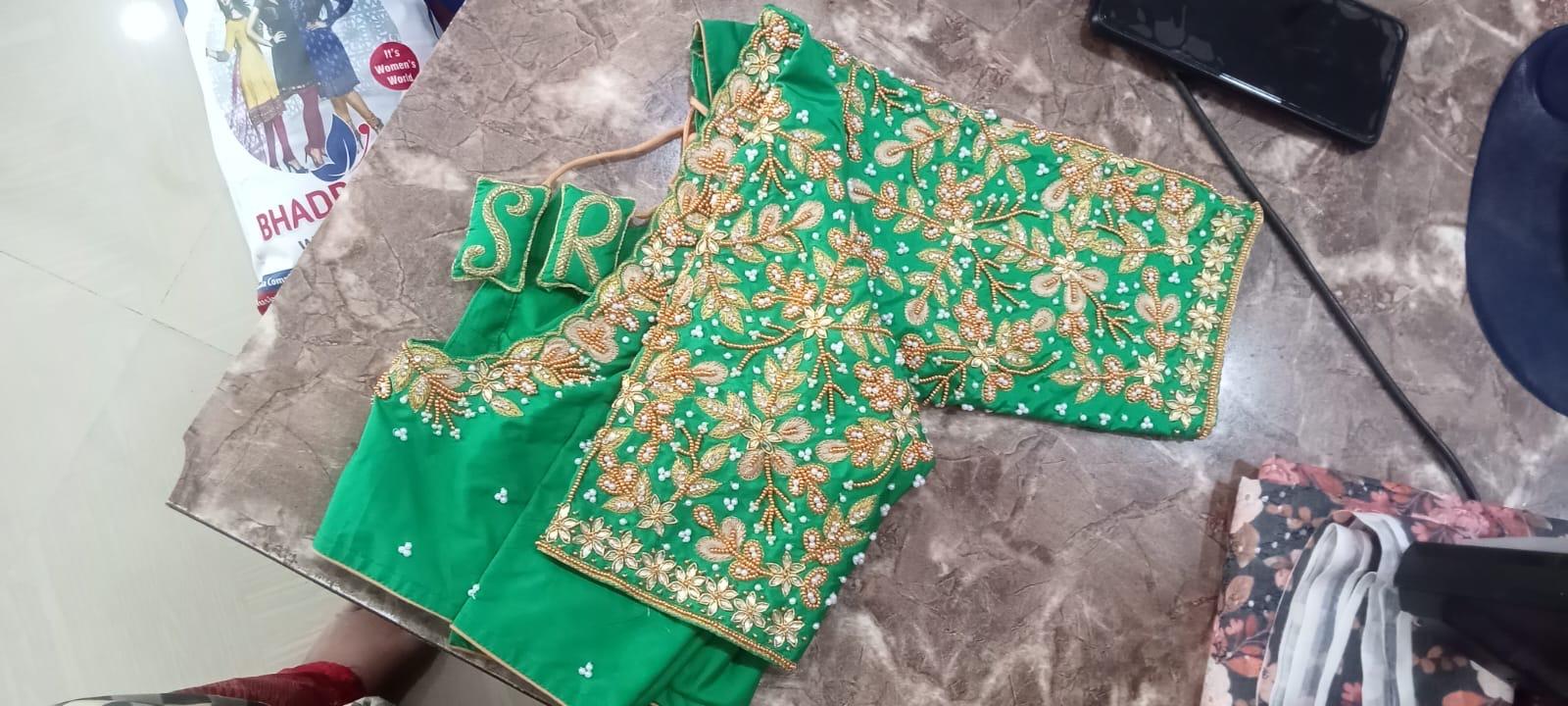 Green silk blouse with gold zari floral embroidery and embellishments