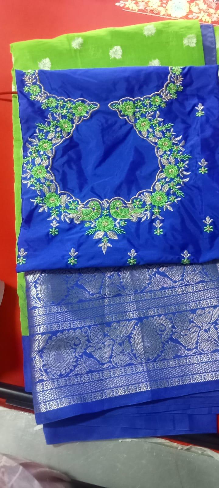 Royal blue silk saree with green zari embroidery and traditional motifs