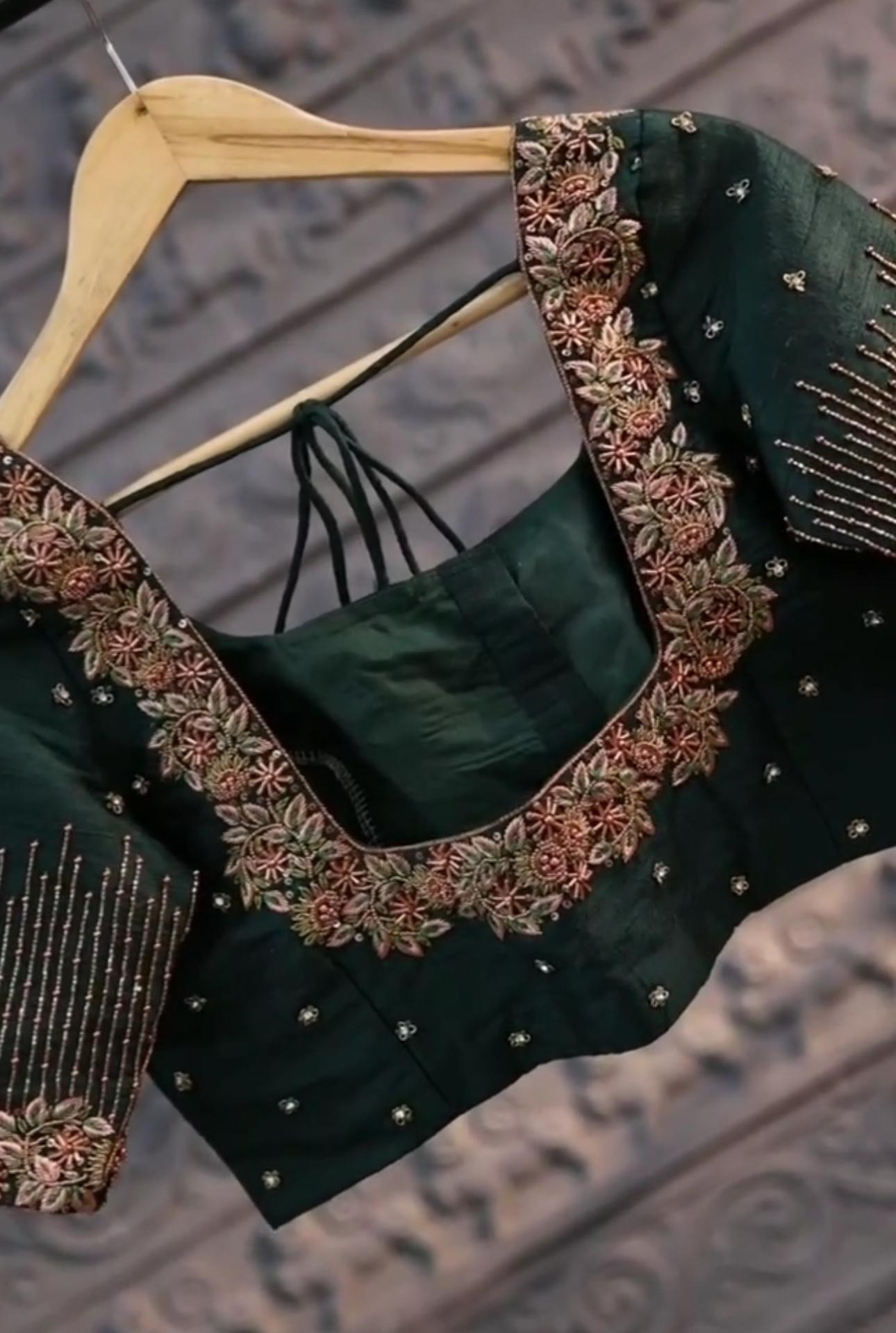 Emerald green blouse with gold floral embroidery and pearl embellishments