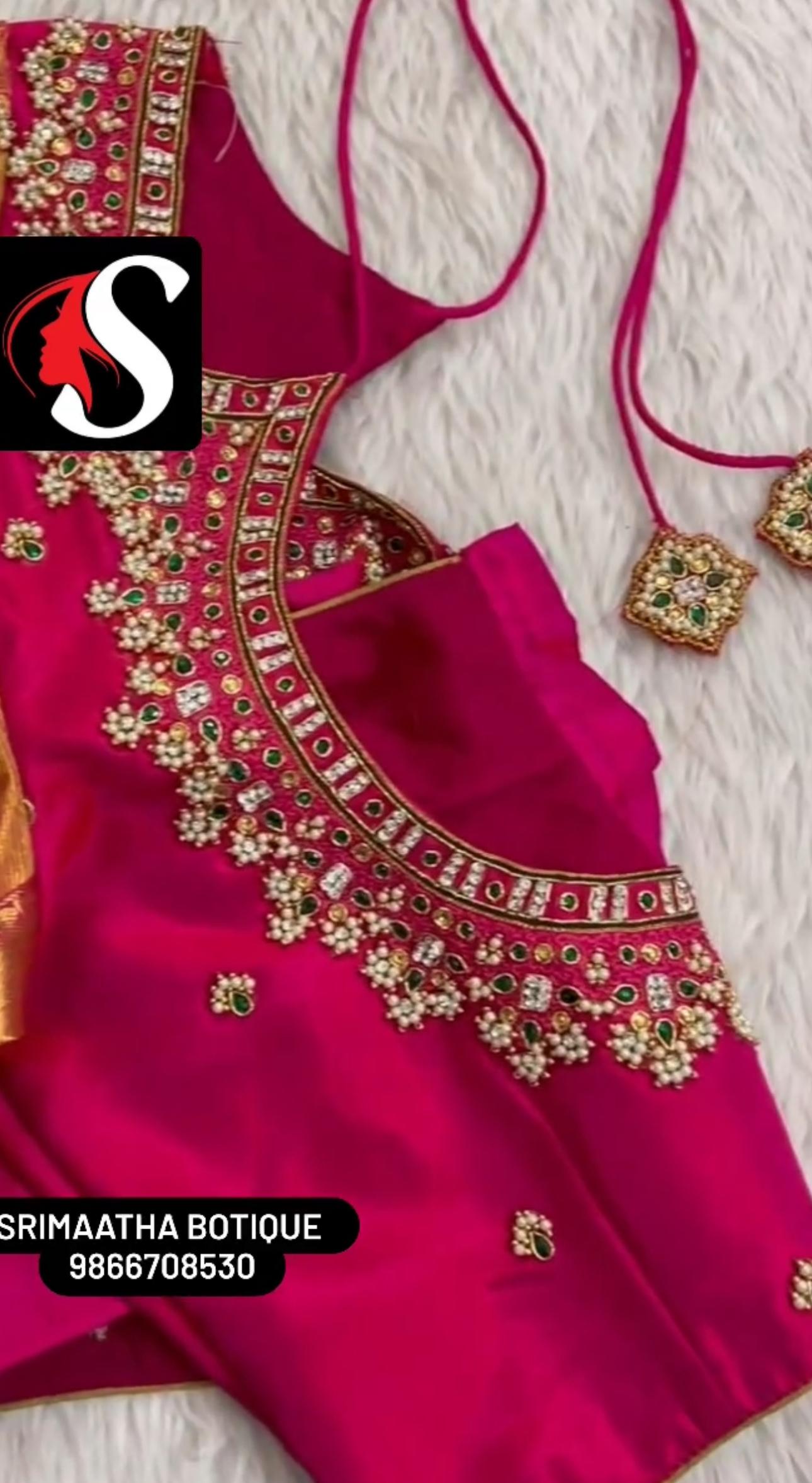 Magenta bridal blouse with gold maggam work and embellishments