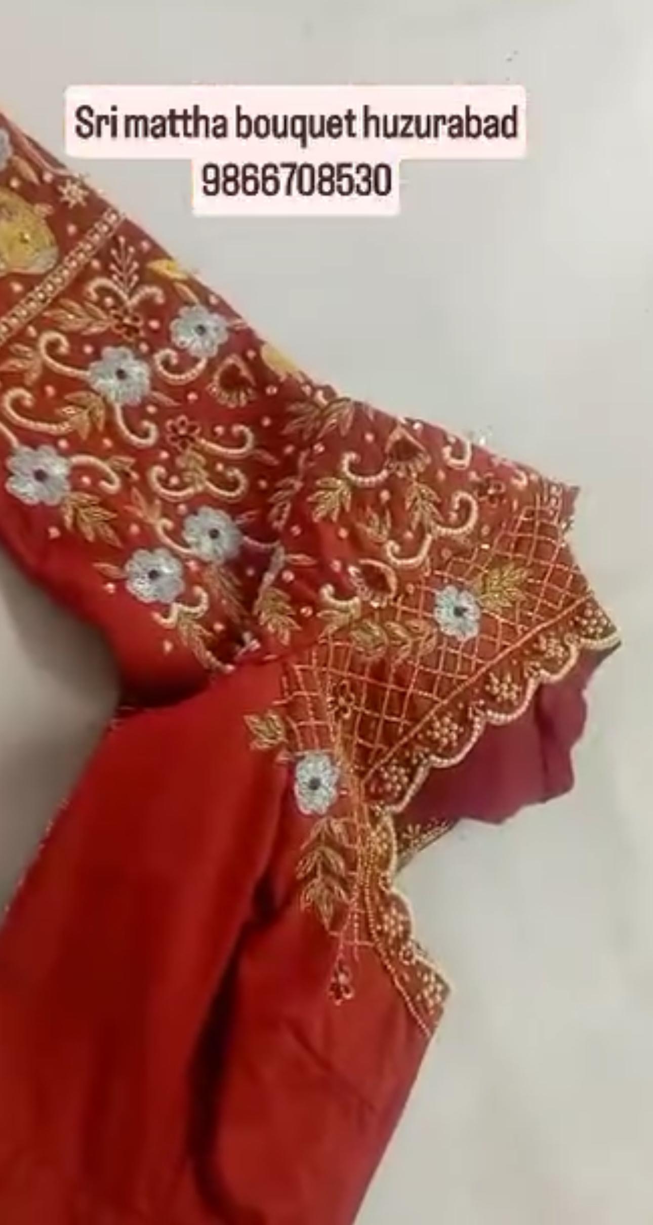 Red bridal blouse with gold zari and mirror embroidery work