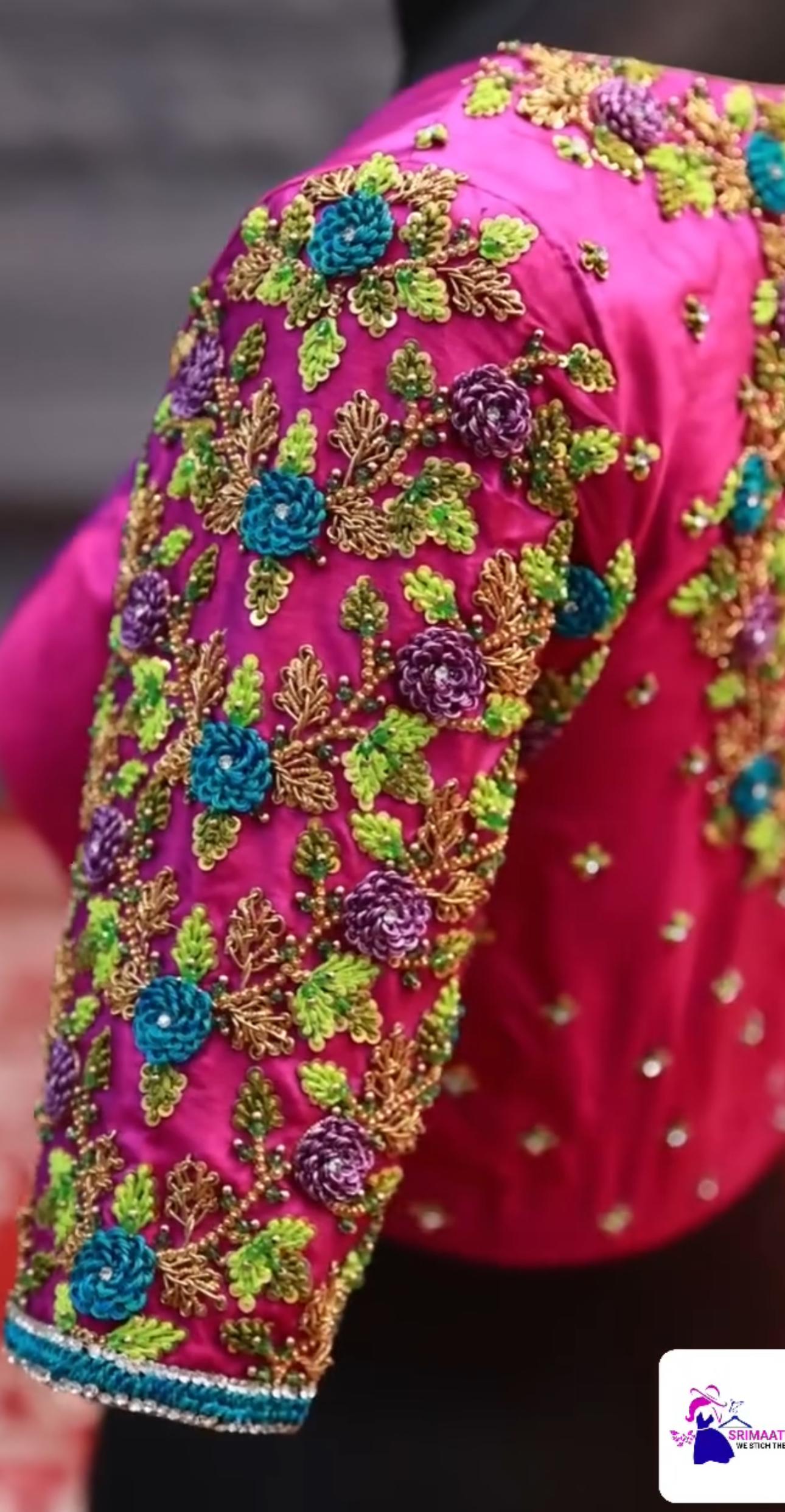 Magenta blouse with dense floral maggam work embroidery and pearl accents