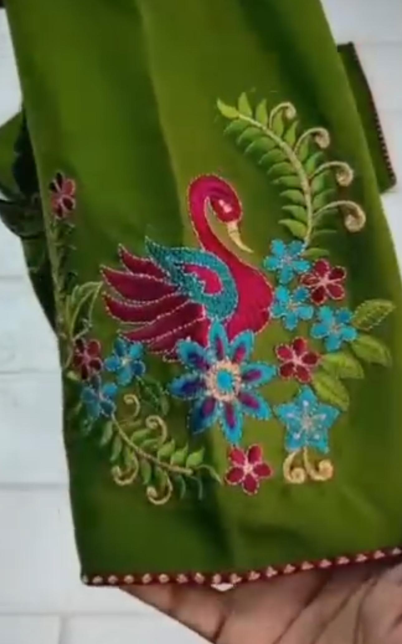Green blouse with colorful peacock embroidery and floral designs