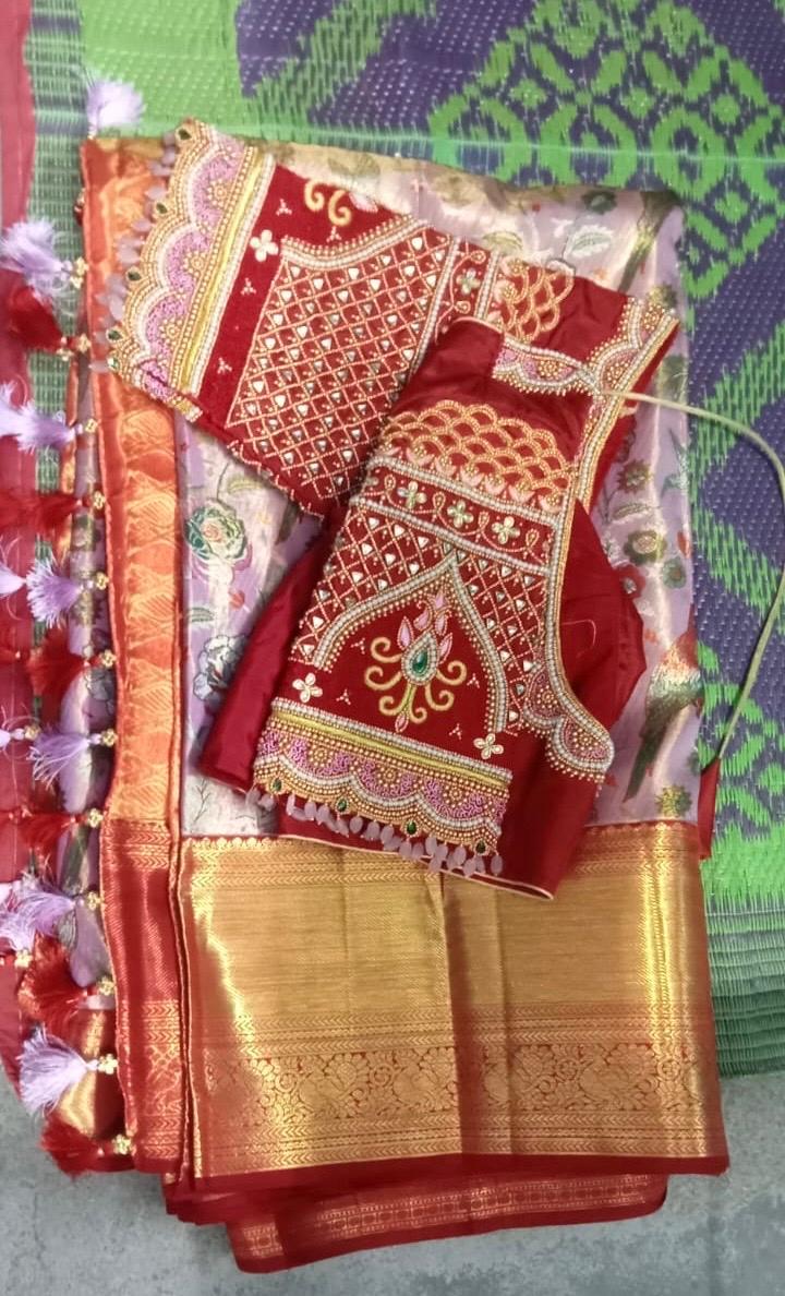 Red bridal blouse with gold zari and stone embroidery work
