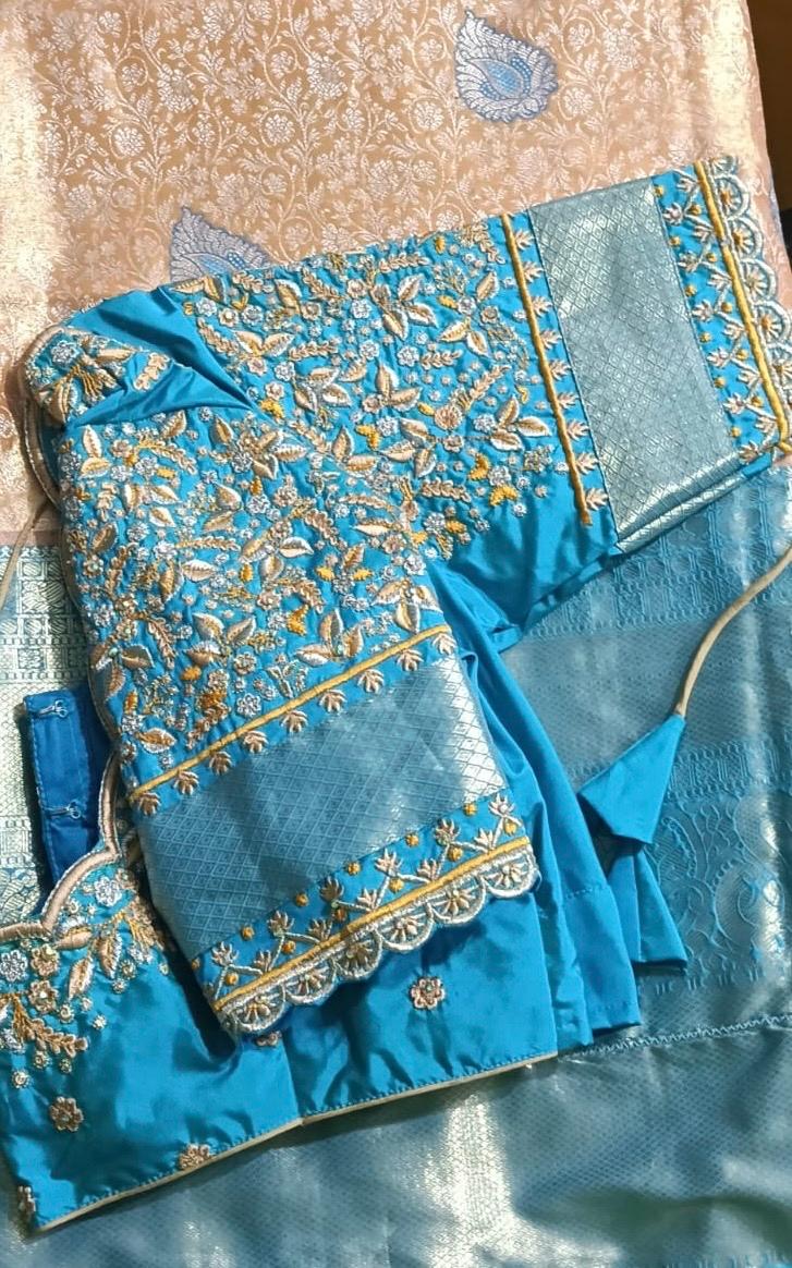 Blue silk saree with gold zari floral embroidery and decorative border