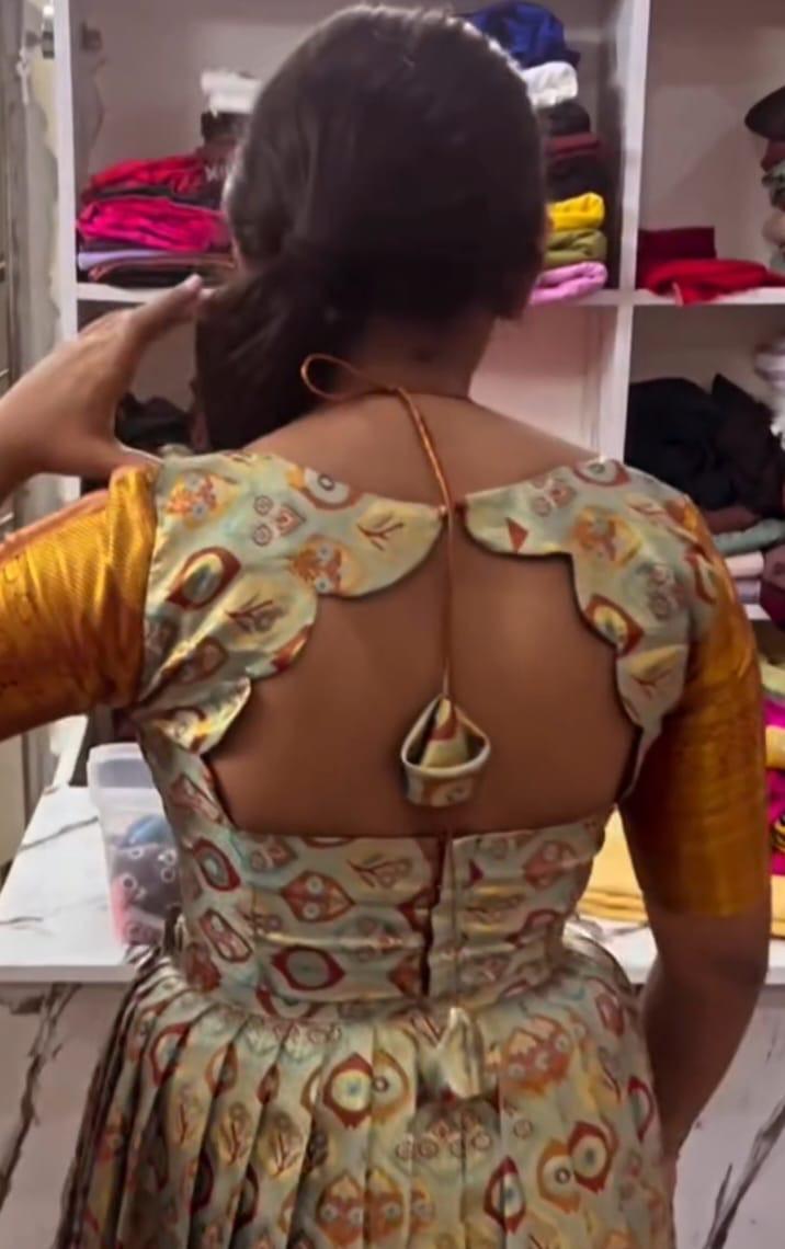 Cream patterned designer blouse with decorative back cutout detail