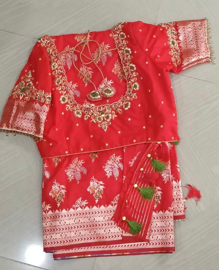 Red bridal saree with gold zari embroidery and floral patterns