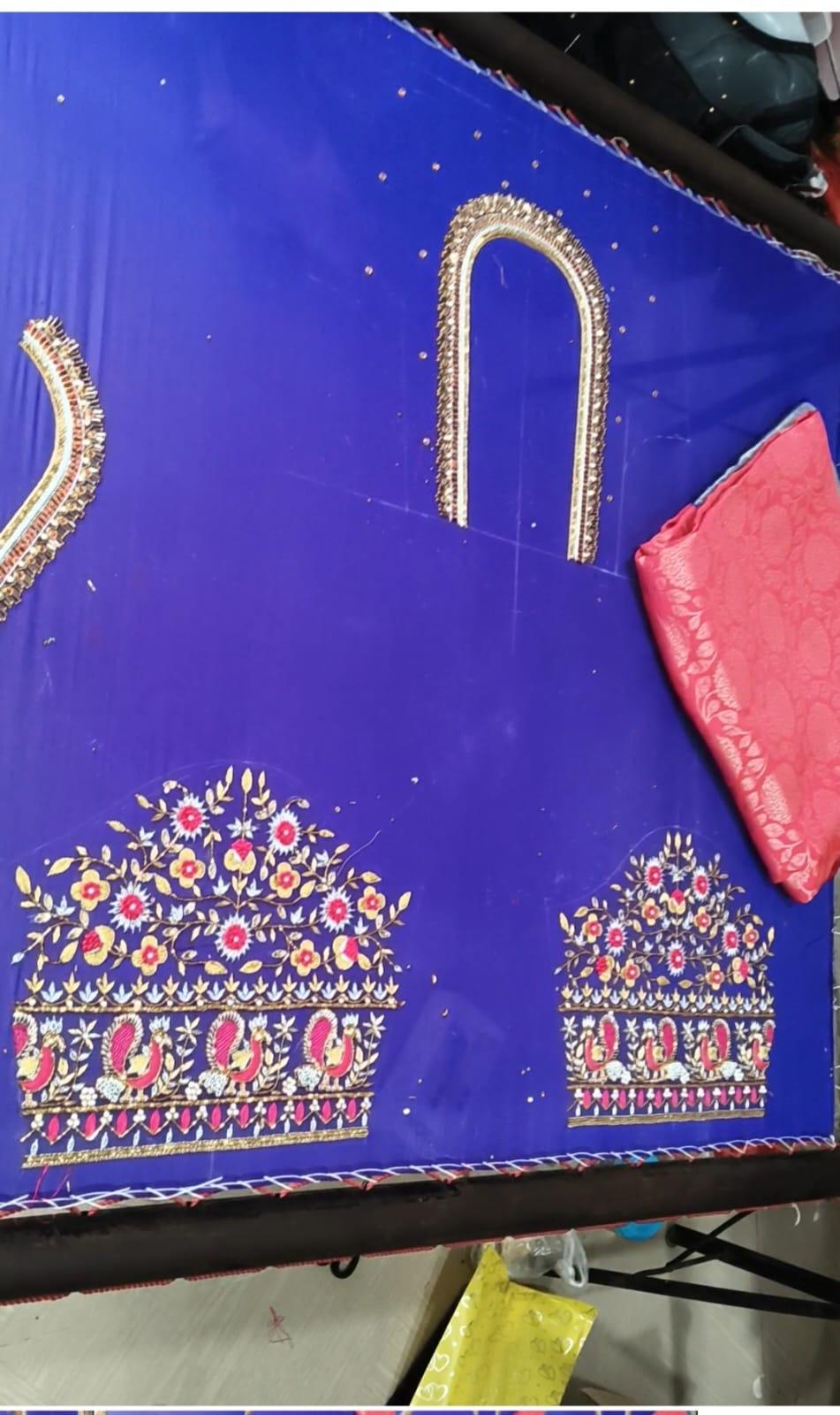 Royal blue saree with ornate gold zari embroidery and floral maggam work