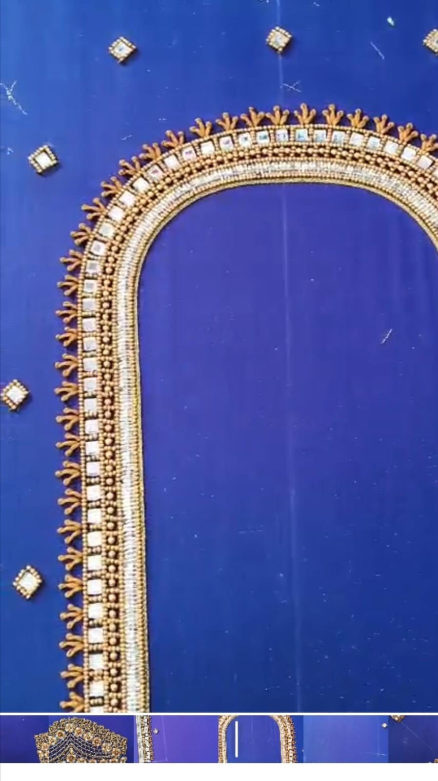 Royal blue saree with ornate gold border and floral embellishments