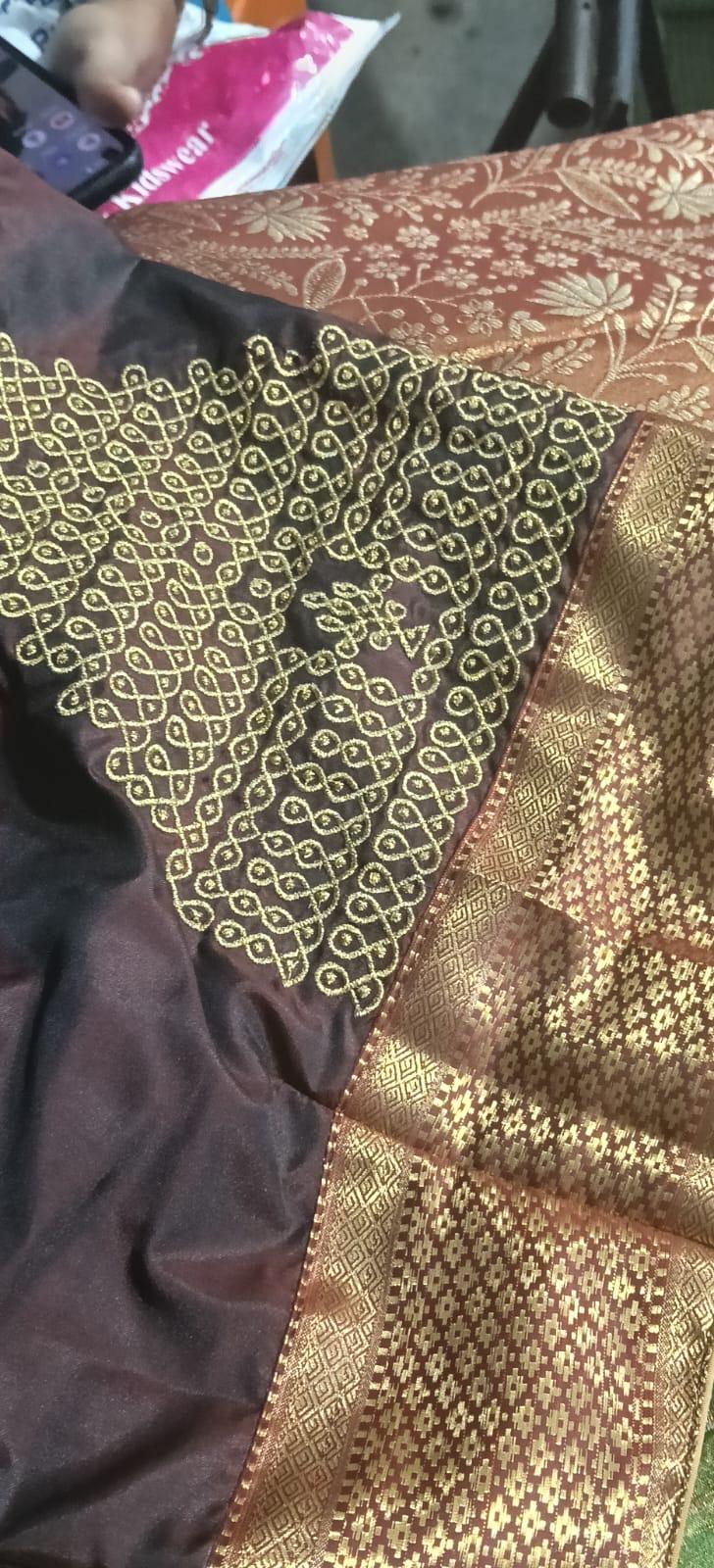 Maroon saree with gold zari embroidery and ornate border work