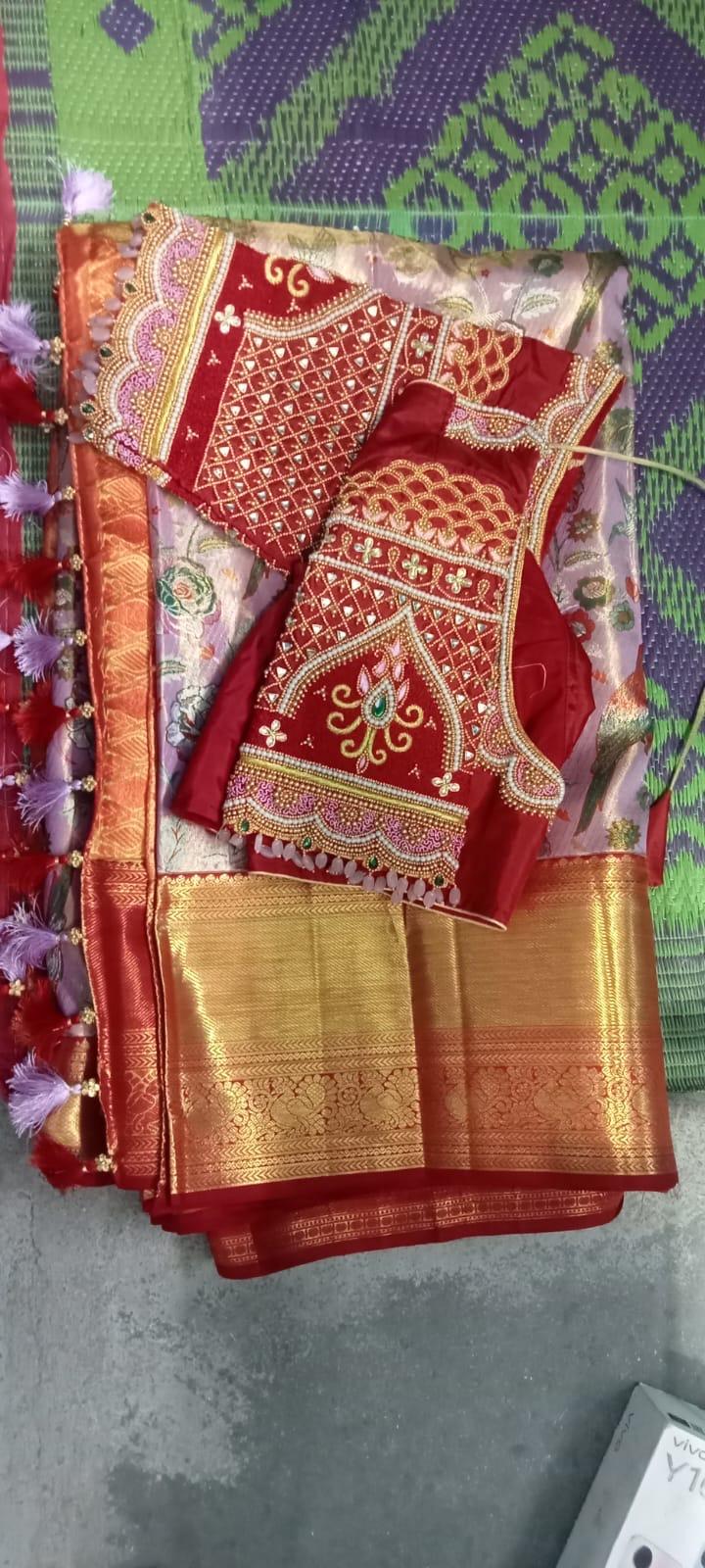 Red bridal blouse with gold zari and stone embroidery work