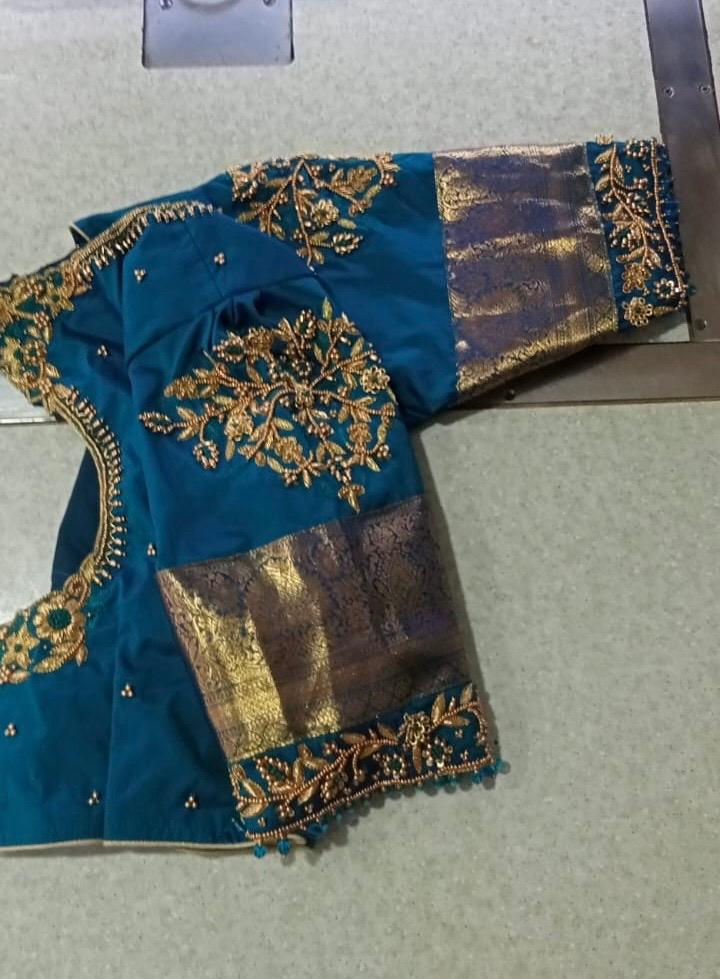 Blue saree with gold zari embroidery and metallic border