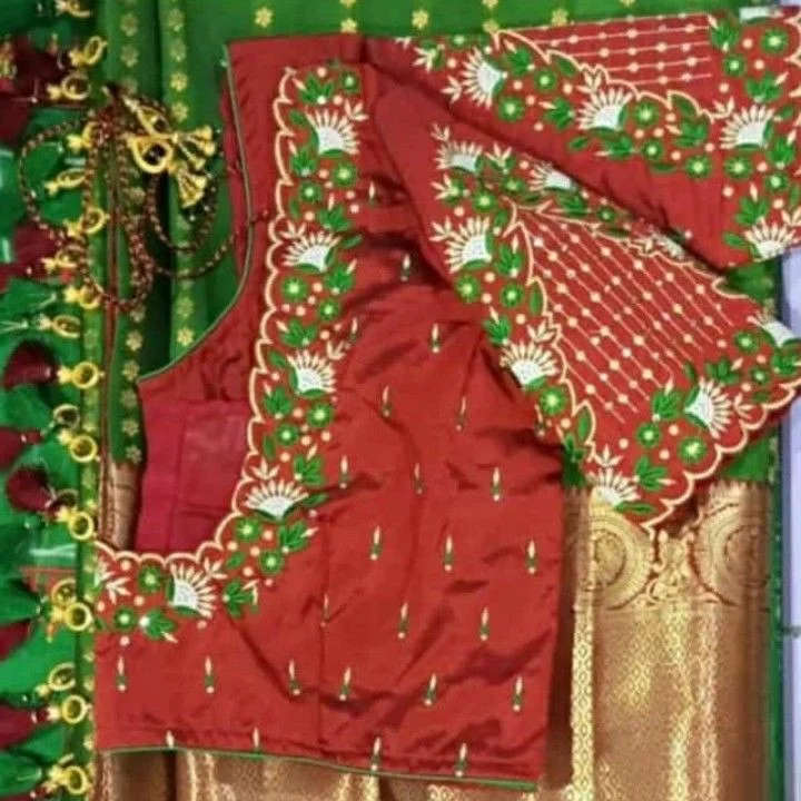 Red silk saree with gold zari and green embroidered floral border