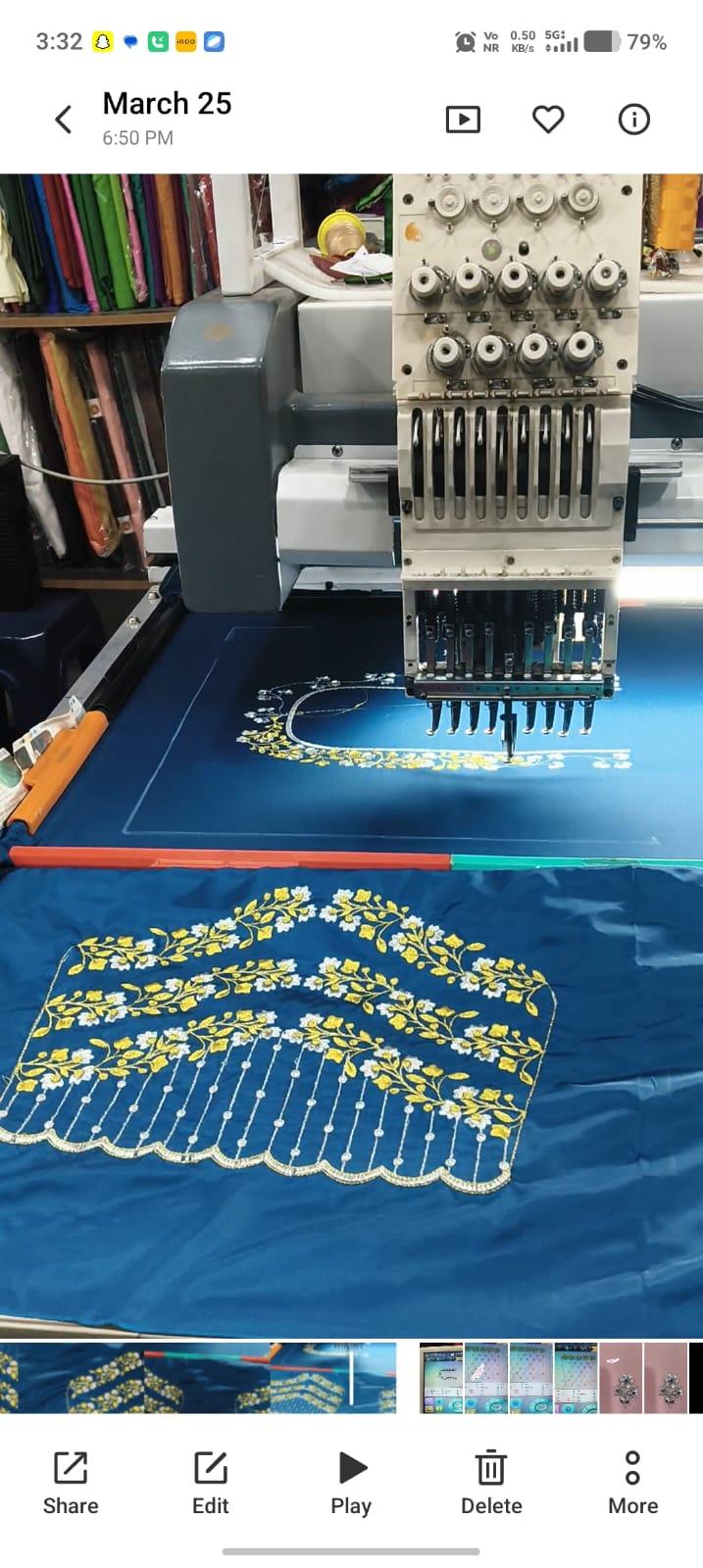 Blue fabric with yellow floral embroidery and scalloped lace border design