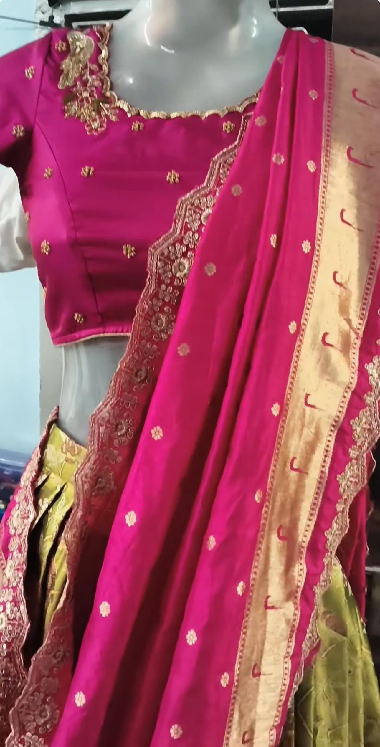Magenta silk blouse with gold zari embroidery and ornate neckline