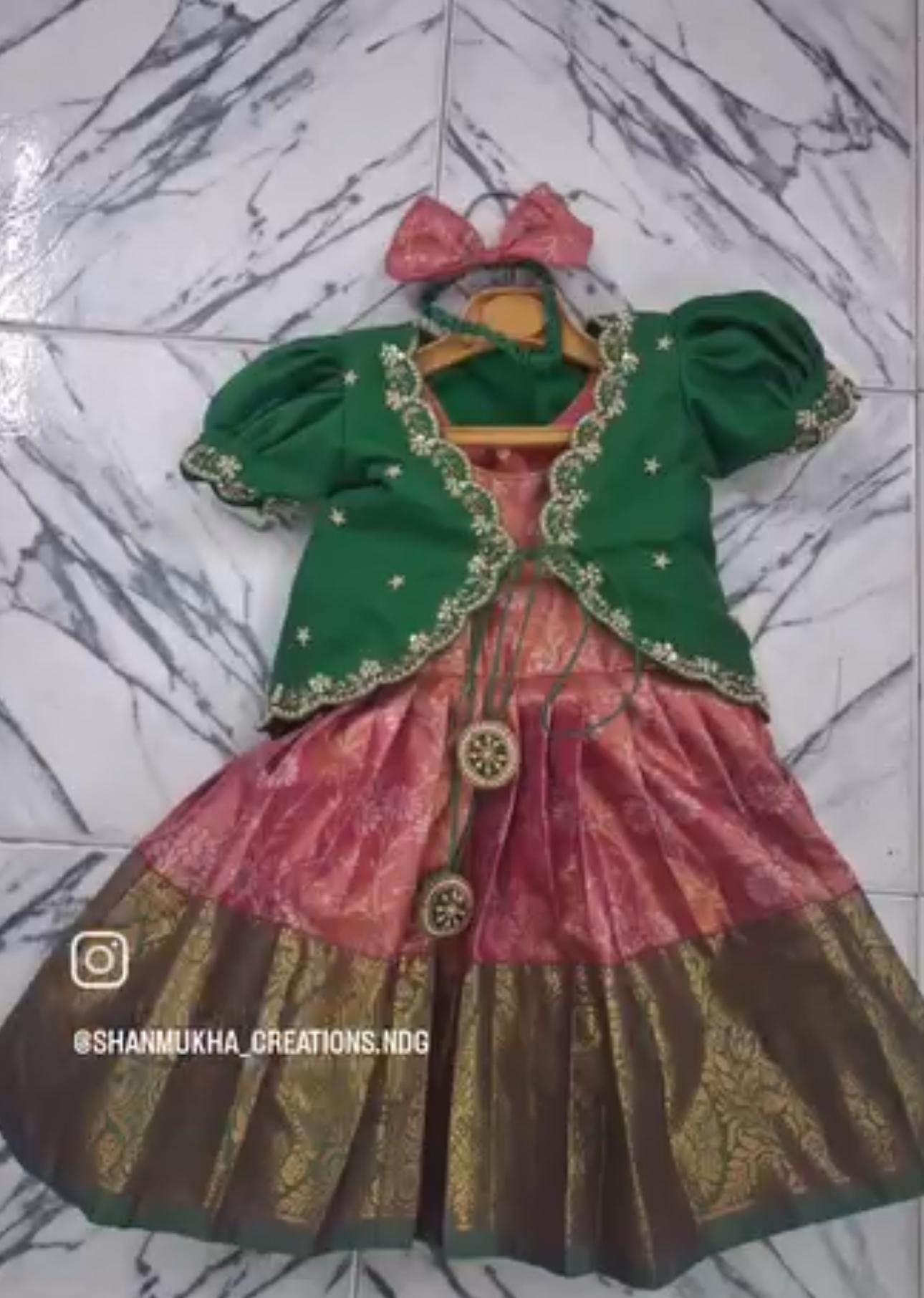 Green jacket with pink dress, gold embroidery and festive styling