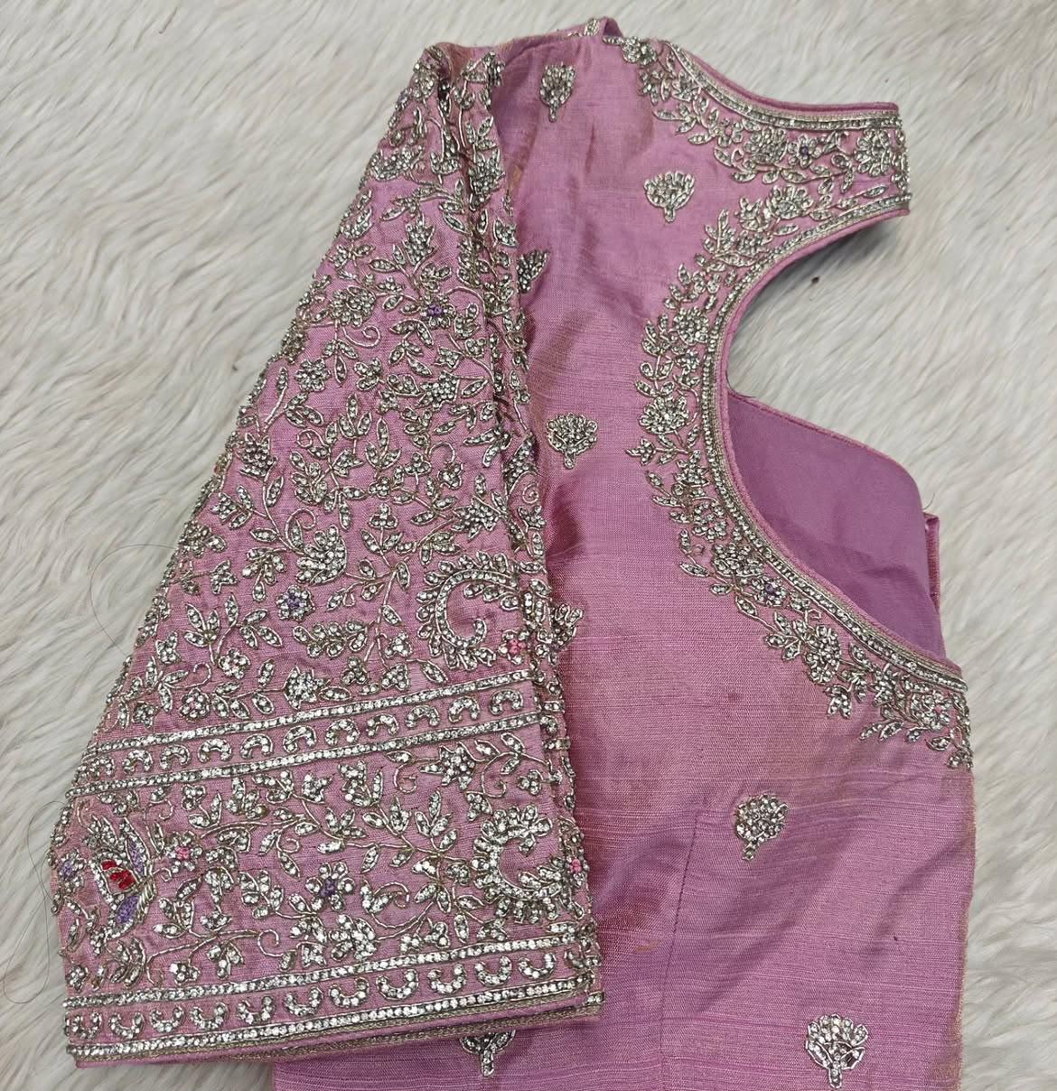Pink bridal blouse with intricate gold maggam work embroidery