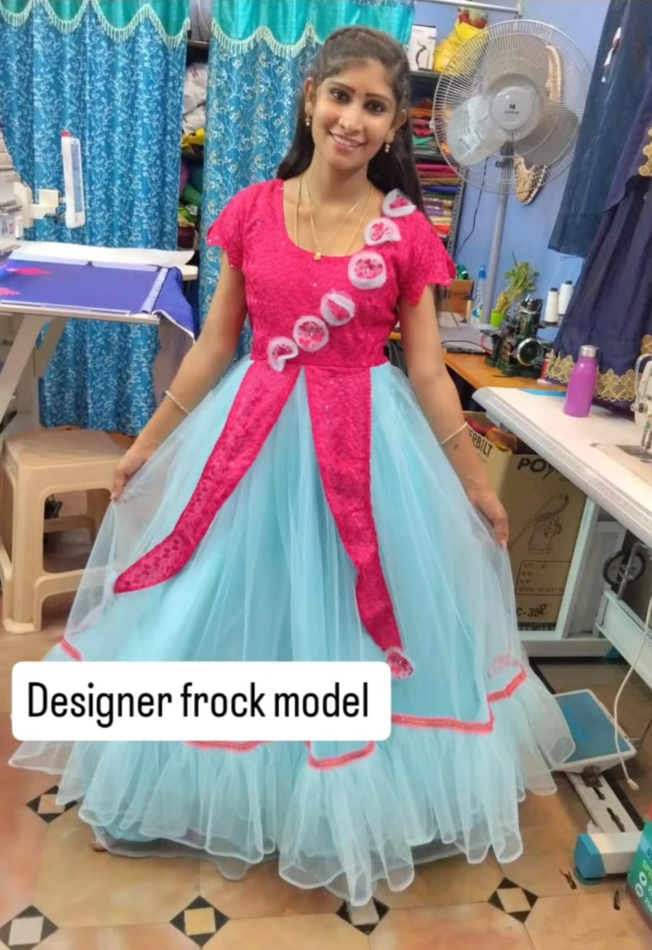 Hot pink and light blue designer frock with circular appliqué embellishments