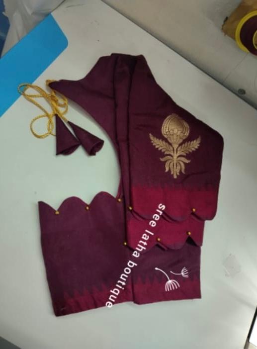 Maroon blouse with gold zari embroidery and scalloped hemline
