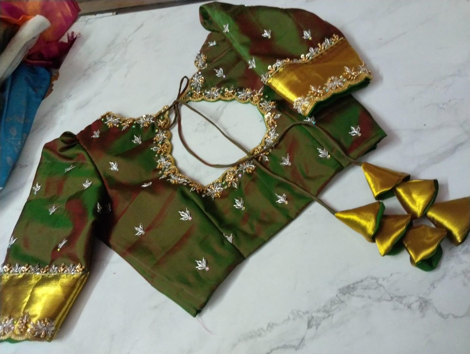 Green silk blouse with gold zari embroidery and matching jewelry set
