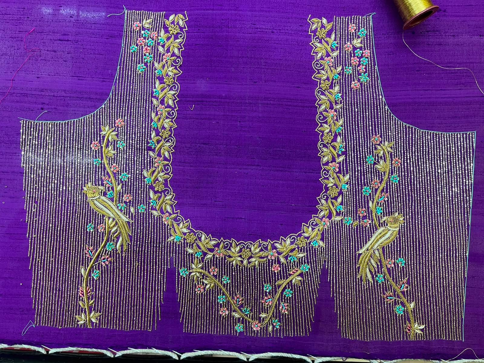 Purple blouse with gold zari embroidery and floral maggam work design