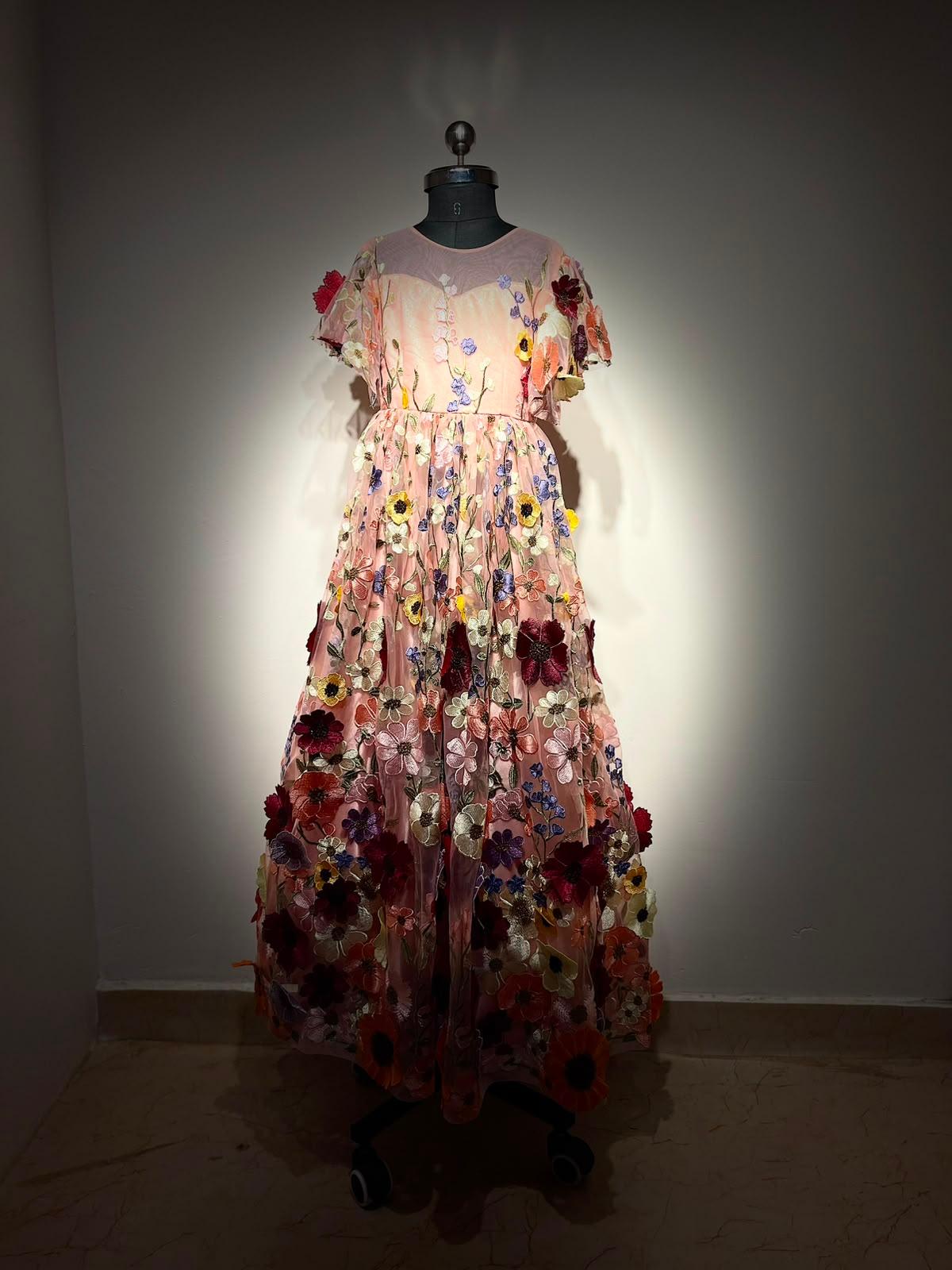 Blush pink gown with 3D floral embellishments and cascading flowers