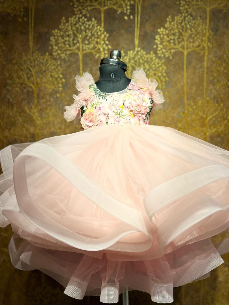 Peach tulle gown with floral embroidered bodice and puff sleeves