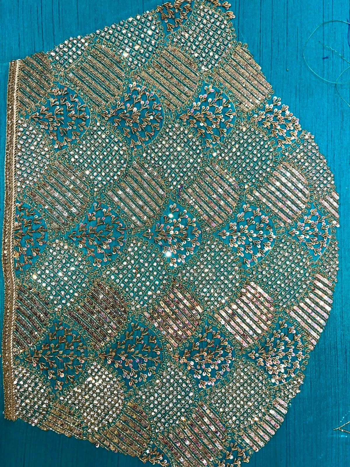 Teal blouse with gold zari and stone embroidery work