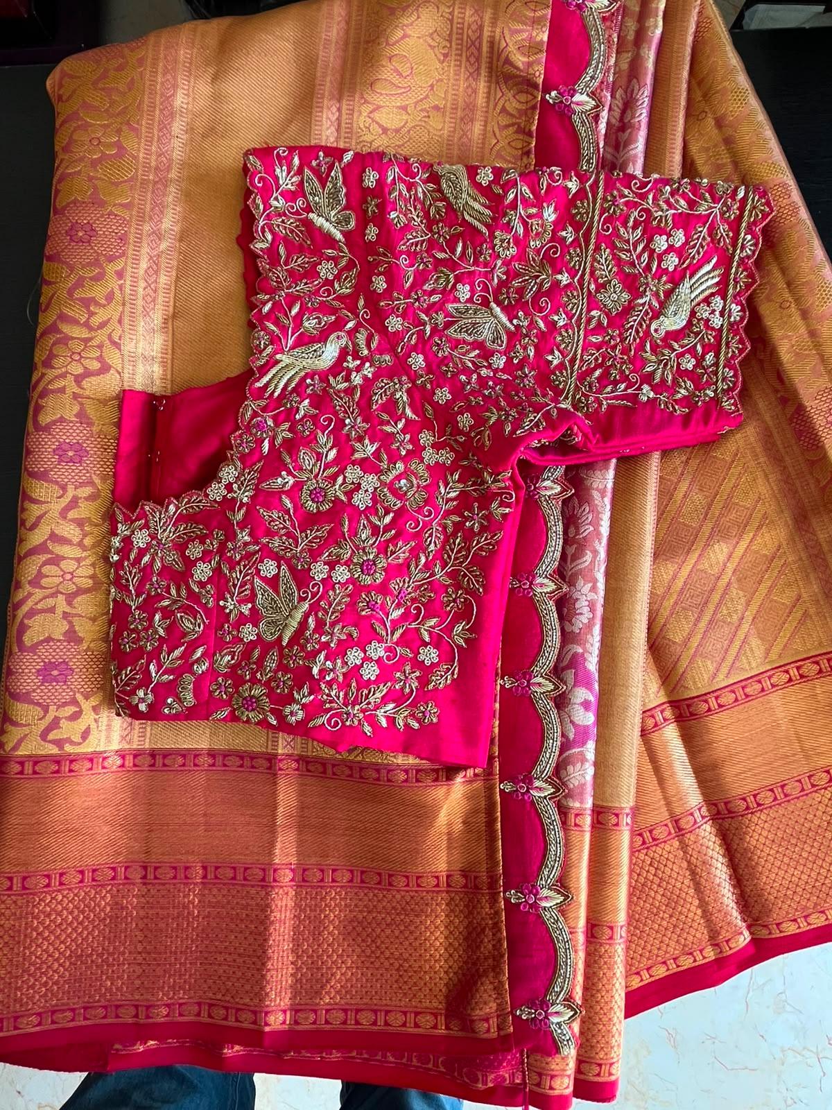 Magenta silk blouse with intricate gold zari floral embroidery and matching saree
