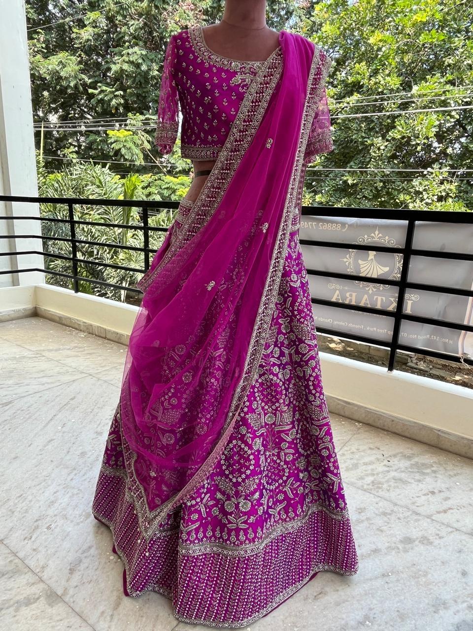 Magenta lehenga with gold zari embroidery and beaded border