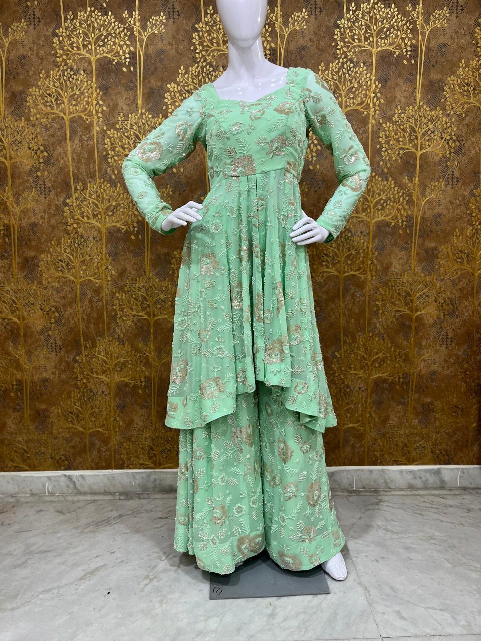 Sea green layered gown with floral embroidery and three-quarter sleeves
