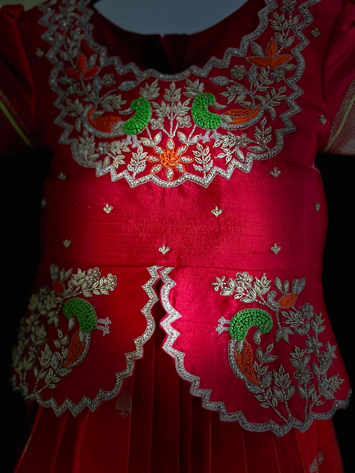 Red bridal blouse with gold zari and green beadwork embroidery