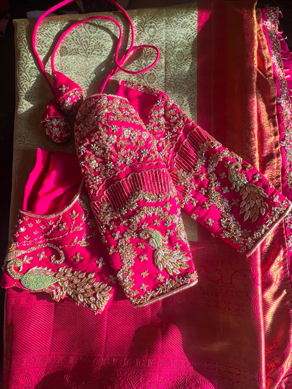 Magenta bridal blouse with gold zari floral embroidery and matching accessories