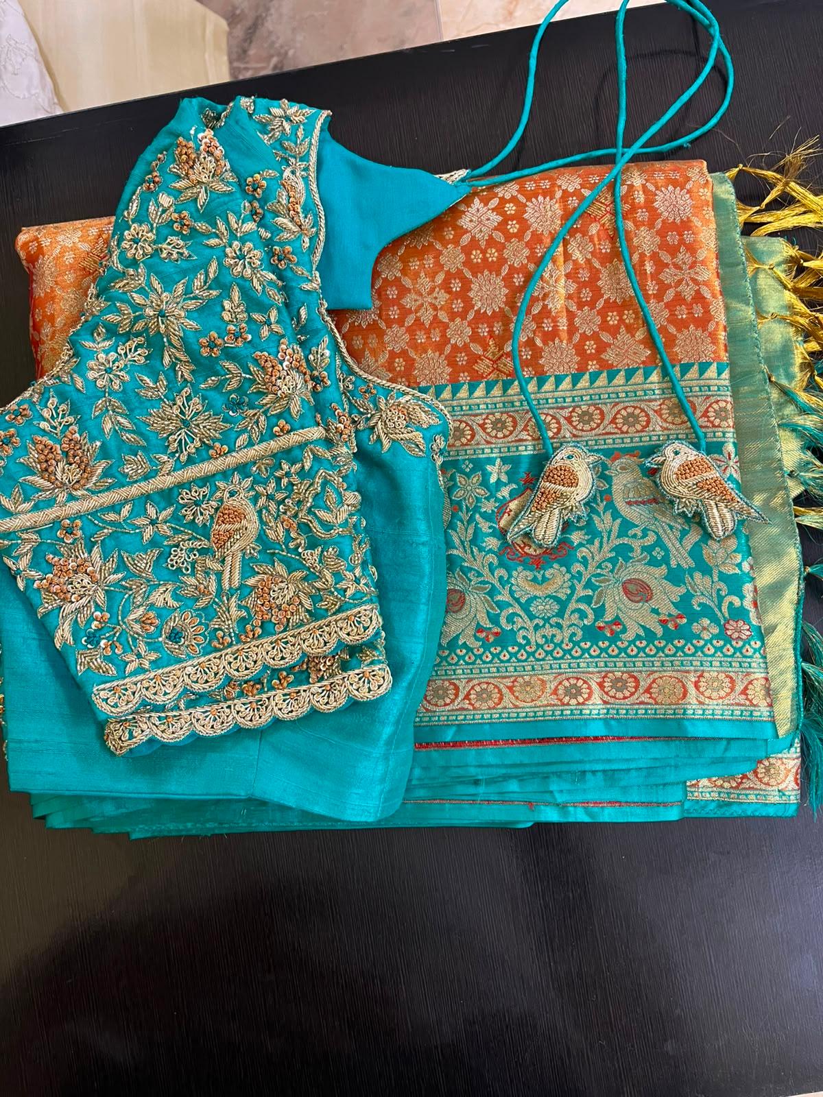 Turquoise silk saree with gold zari embroidery and ornate border