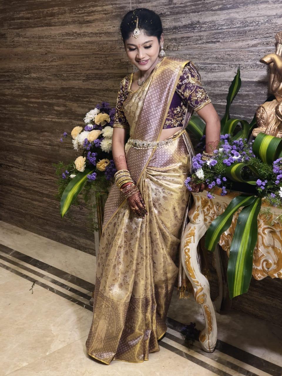 Gold silk saree with purple blouse and zari embroidery work