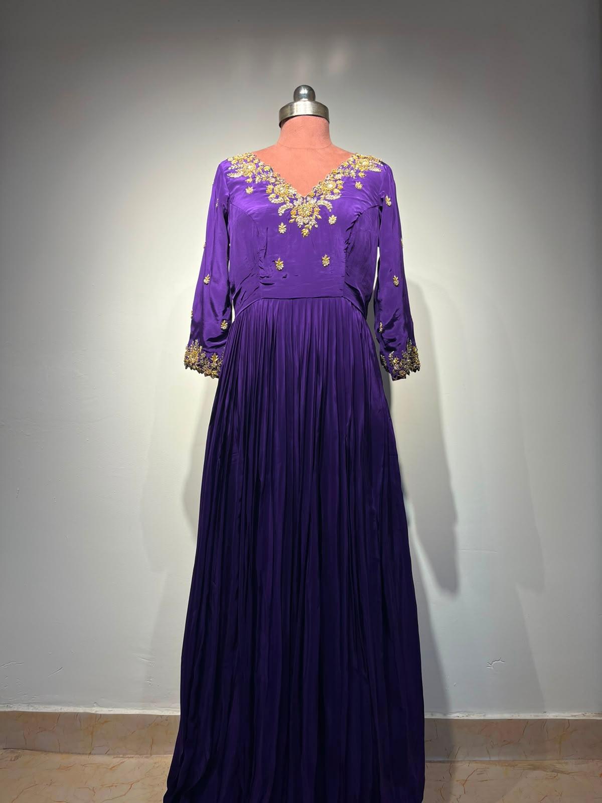 Purple maxi gown with gold embroidered neckline and sleeves