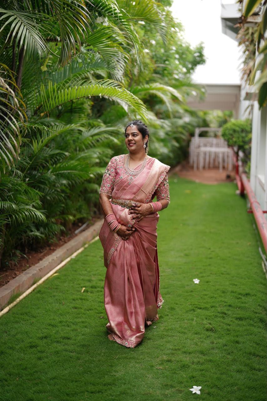 Pink silk saree with gold maggam work blouse and decorative border