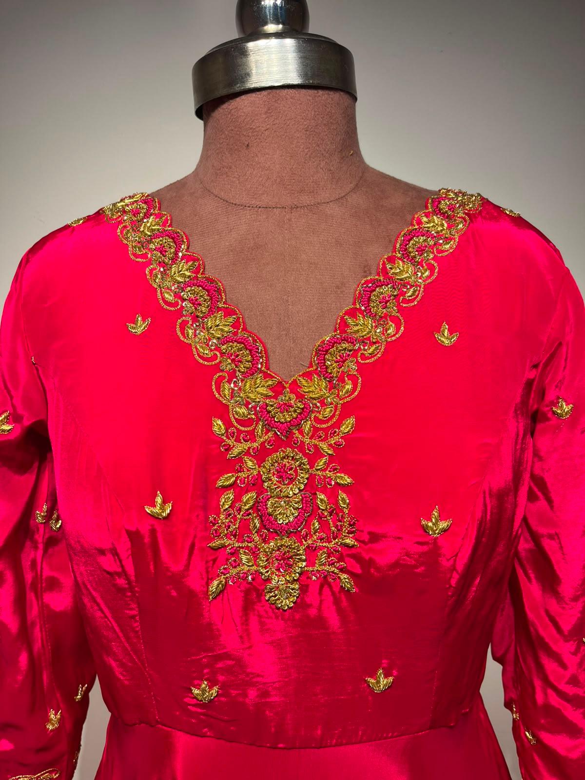 Bright pink silk blouse with gold zari embroidery and decorative motifs
