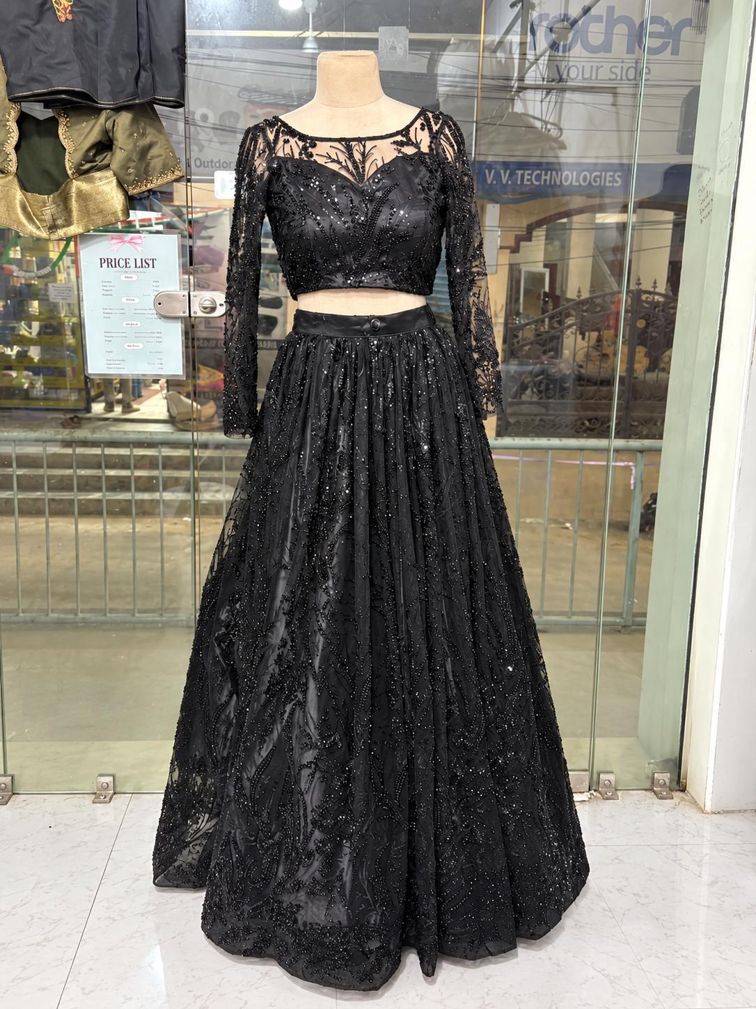 Black sequined crop top lehenga with long sleeves and ornate embroidery