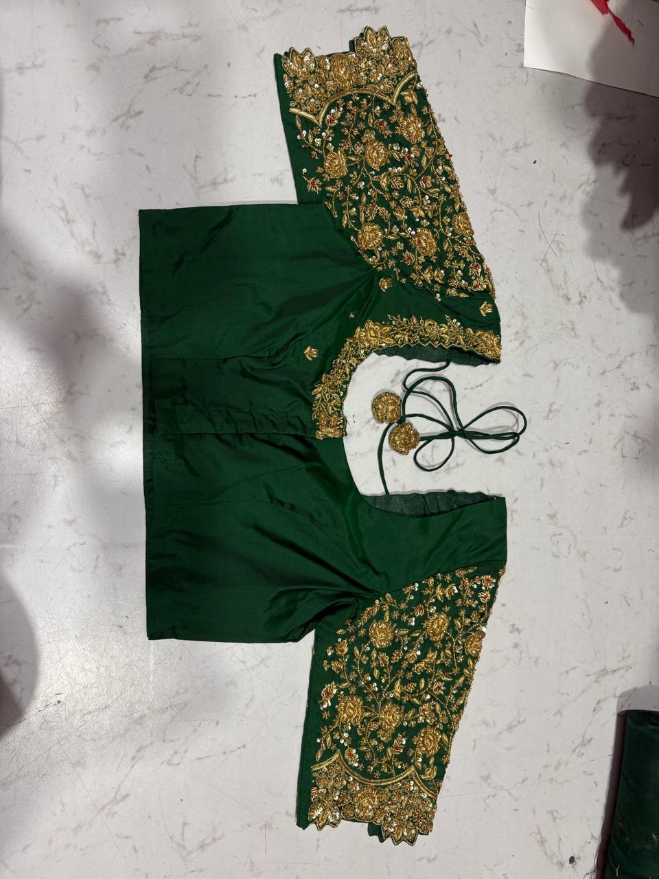Green silk blouse with gold zari embroidery and floral maggam work