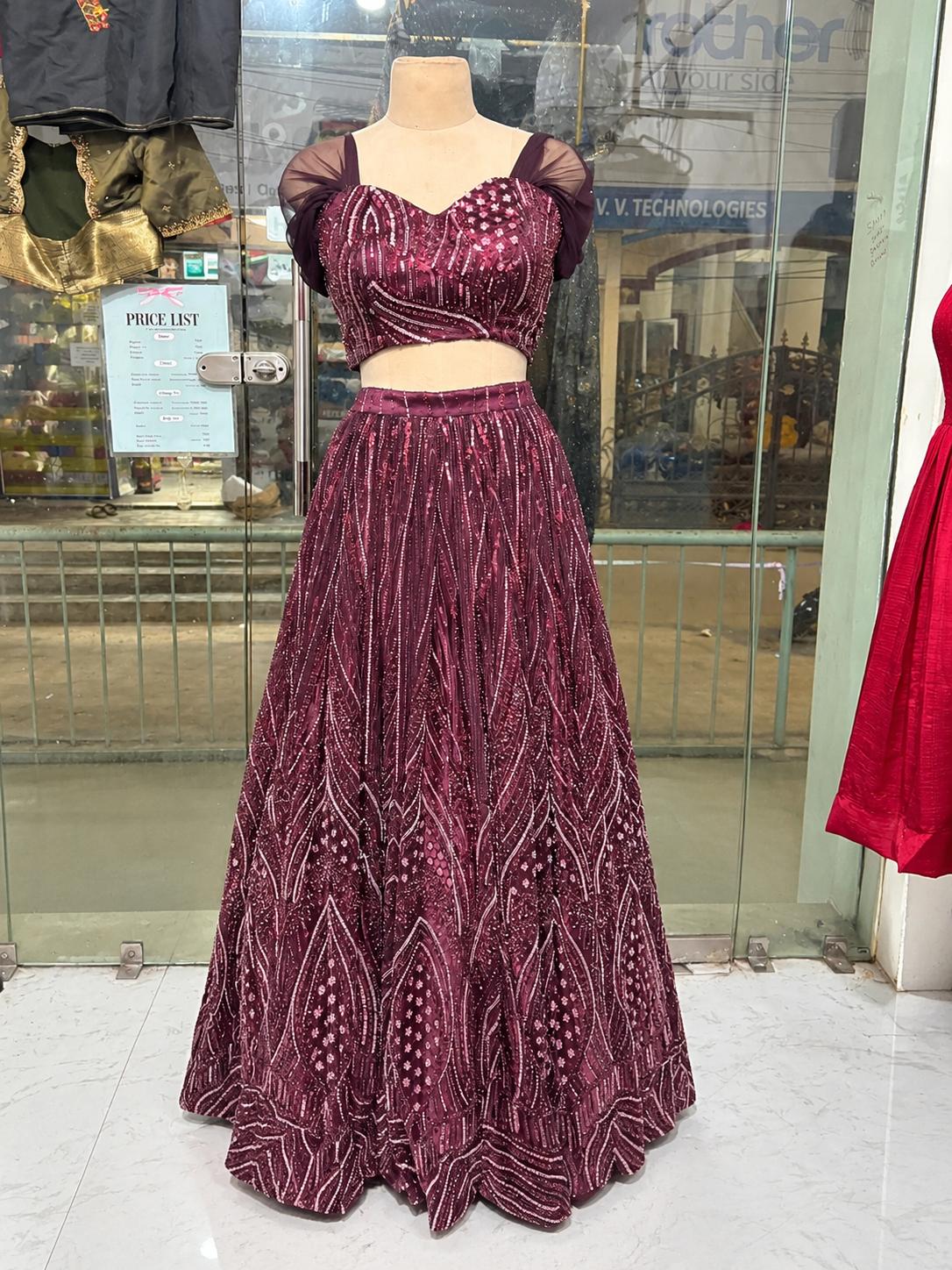 Maroon beaded lehenga with intricate geometric and floral embroidery work