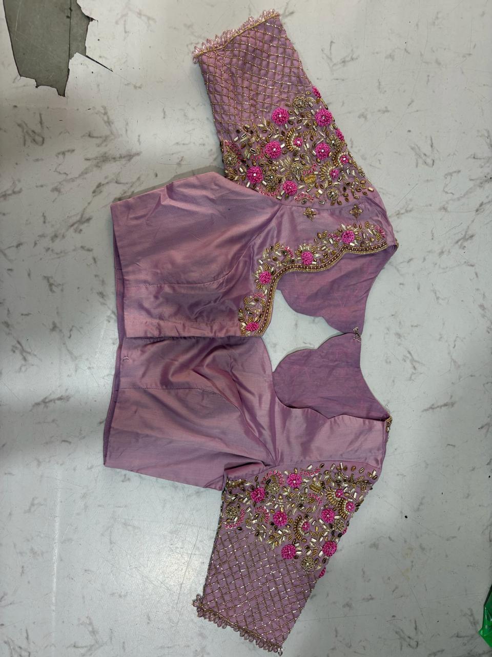 Purple blouse with vibrant maggam work floral embroidery and net yoke