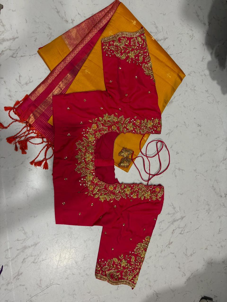Red saree with gold zari embroidery and yellow blouse piece