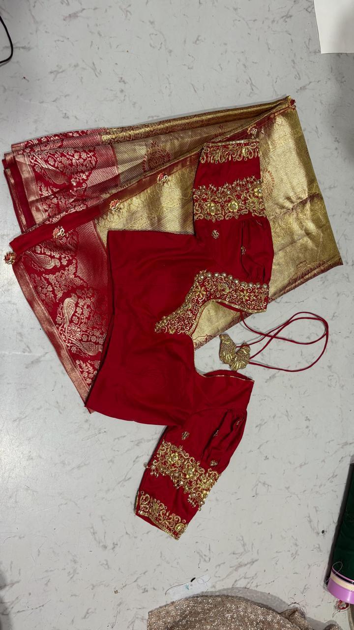 Red and gold bridal lehenga set with zari embroidery and traditional detailing