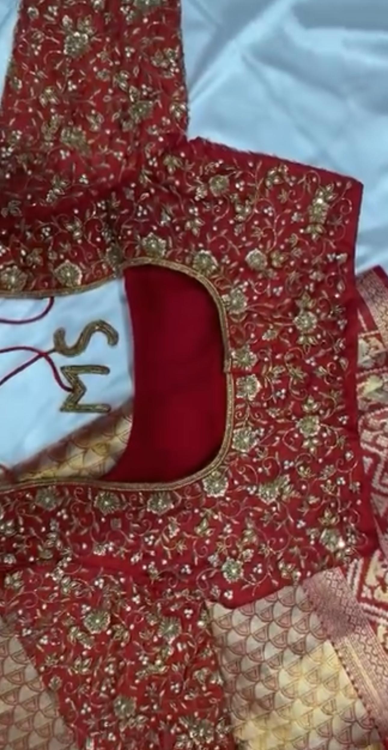 Red bridal blouse with dense gold zari floral embroidery work