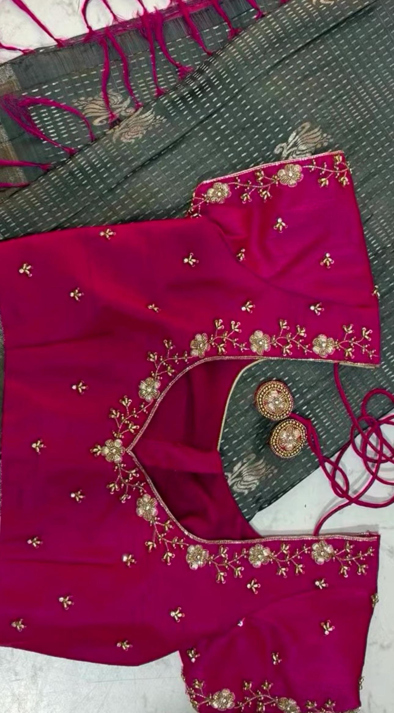 Magenta bridal blouse with gold zari embroidery and floral designs