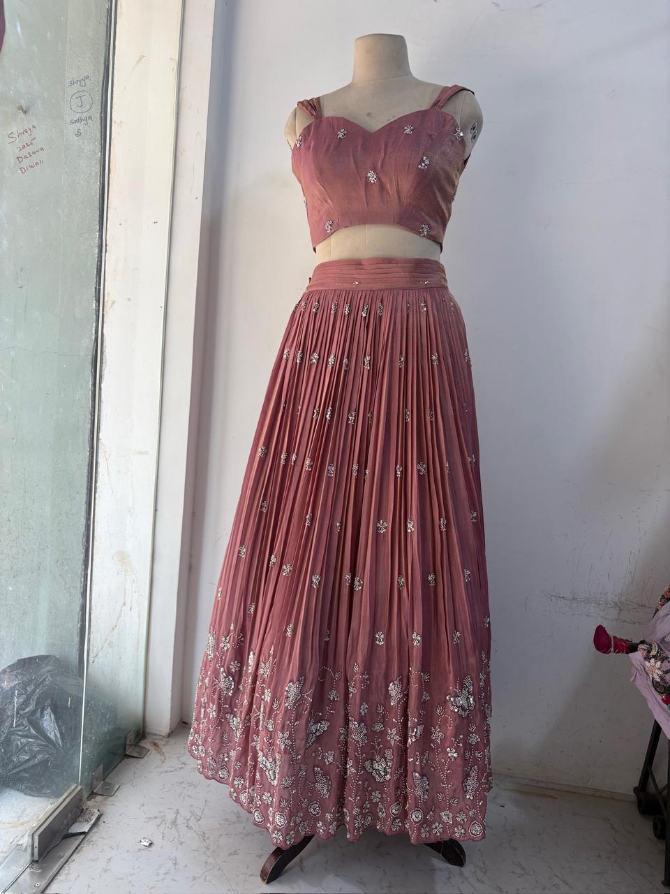 Maroon lehenga with pleated skirt and embellished crop top blouse